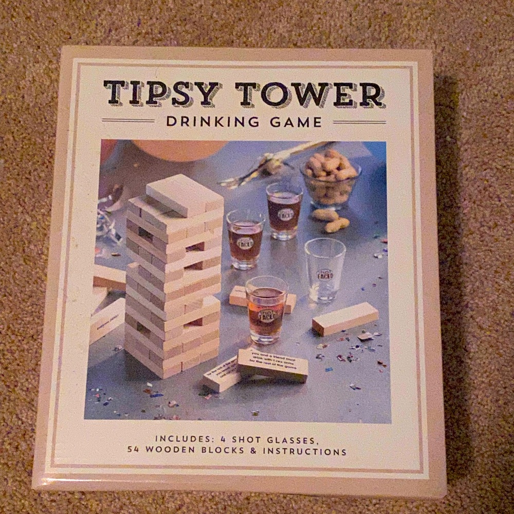 Tipsy Tower Drinking Game includes 4 Shot Glasses, 54 Wooden Blocks